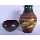 A STYLISH ARTS AND CRAFTS POTTERY VASE together with a jarlet. Largest 30 cm high. (2)