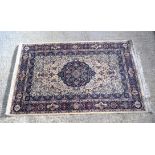 A Persian rug. 220cm x 139cm