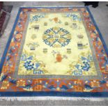 A Large Yellow ground rug decorated with auspicious symbols. 366cm x 274cm