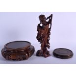 A 19TH CENTURY CHINESE CARVED HARDWOOD FIGURE OF AN IMMORTAL together with two stands. (3)