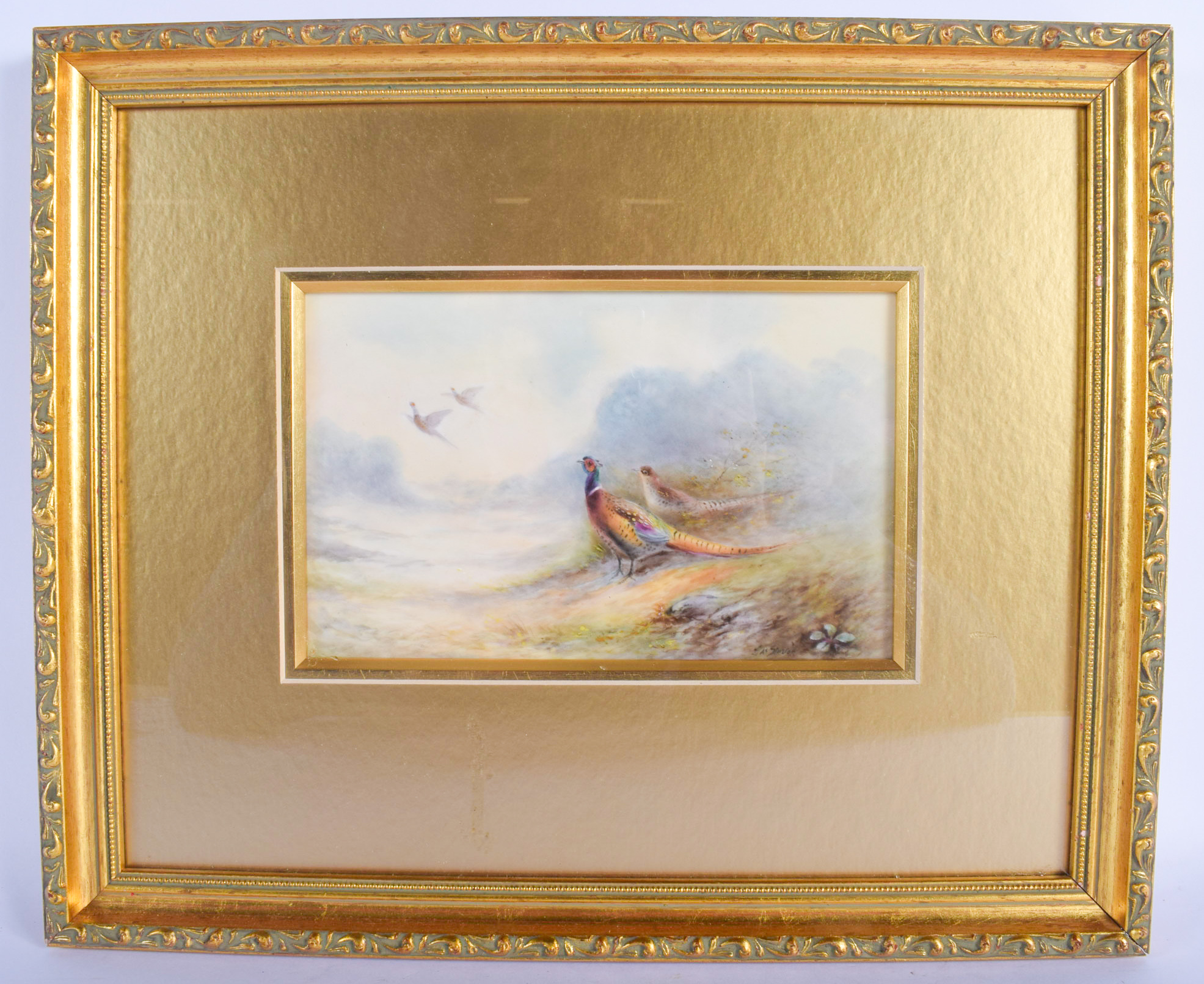 A FRAMED ROYAL WORCESTER PORCELAIN PLAQUE by James Stinton, depicting four pheasants within landsca