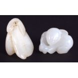 TWO CHINESE CARVED WHITE JADE FIGURES 20th Century. Largest 2.5 cm wide. (2)