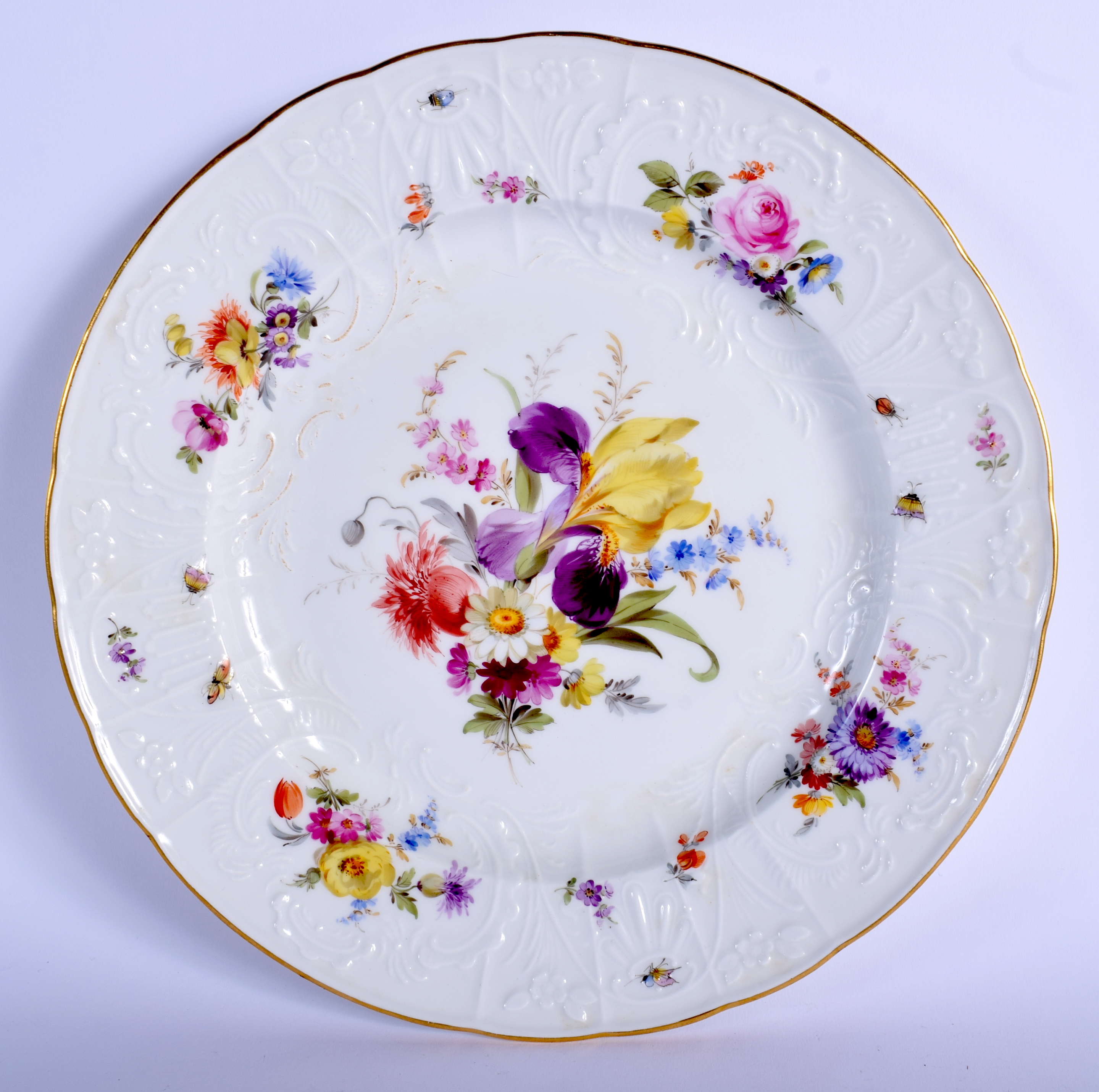 A 19TH CENTURY MEISSEN PORCELAIN CABINET PLATE painted with flowers over a moulded border. 24 cm wi