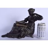 A 19TH CENTURY EUROPEAN BRONZE FIGURE OF A LEANING FEMALE modelled holding an open book. 28 cm x 24