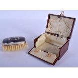A BOXED ANTIQUE SILVER AND TORTOISESHELL BRUSH. 8 cm x 4.5 cm.
