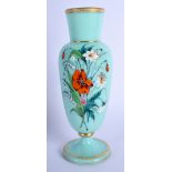 A LATE VICTORIAN ENAMELLED GREEN GLASS VASE painted with flowers. 20 cm high.