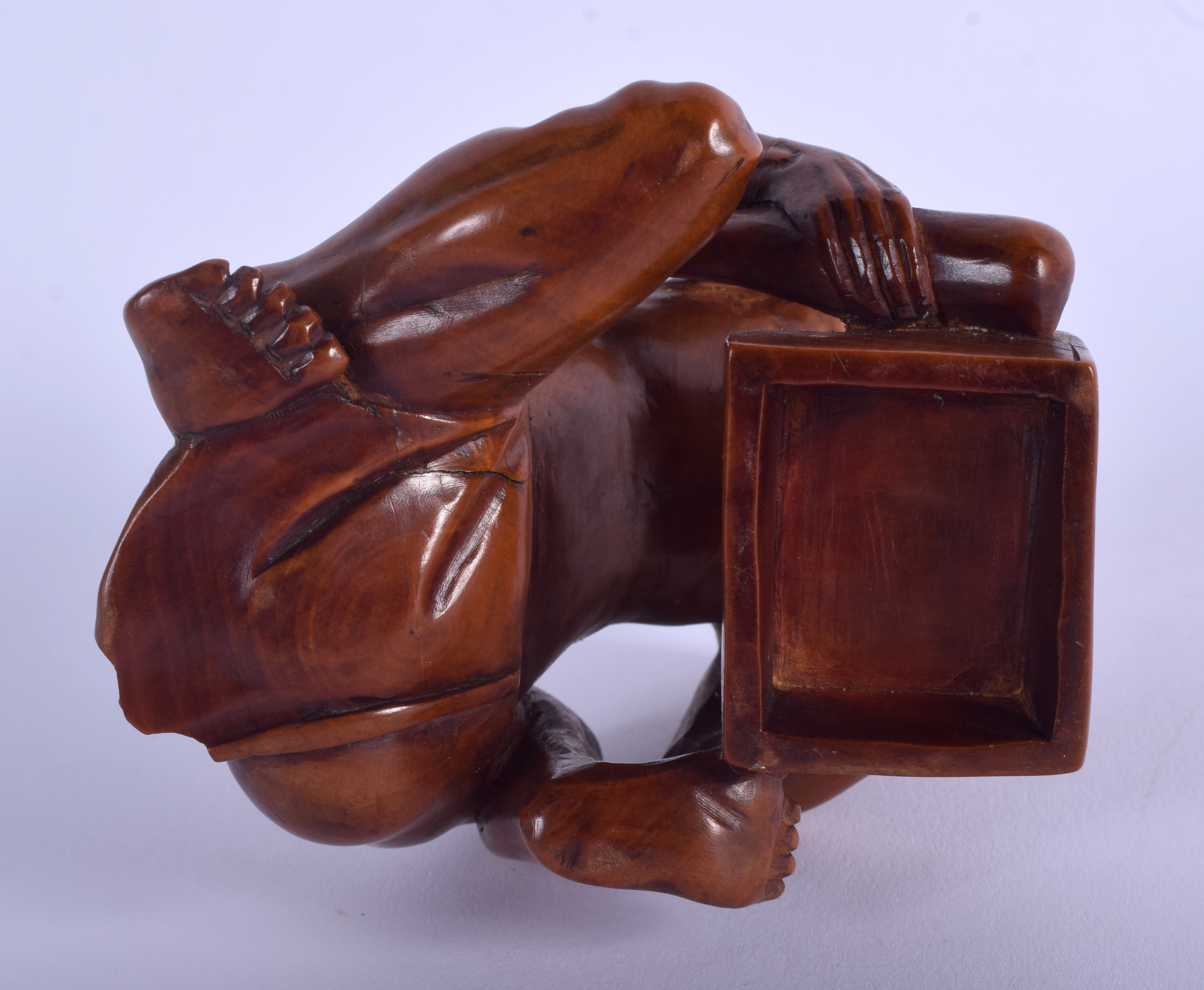 A 19TH CENTURY JAPANESE MEIJI PERIOD CARVED BOXWOOD RAT CATCHER modelled scowling upon an upturned - Image 3 of 3