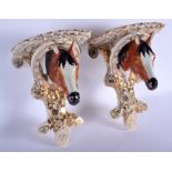 A PAIR OF 19TH CENTURY CONTINENTAL LUSTRE EQUESTRIAN BRACKETS modelled as horses heads. 27 cm x 16