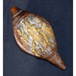 A Tibetan bronze snail shell decorated with figures. 24cm x 12 cm