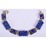 A STYLISH 14CT GOLD ENAMEL AND LAPIS LAZULI BRACELET painted with dragons. 18.9 grams. 16.5 cm long