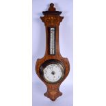 AN EDWARDIAN BAROMETER. 60 cm long.