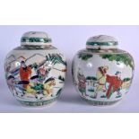 A PAIR OF 19TH CENTURY CHINESE FAMILLE VERTE GINGER JARS AND COVER painted with warriors. 19 cm x 1
