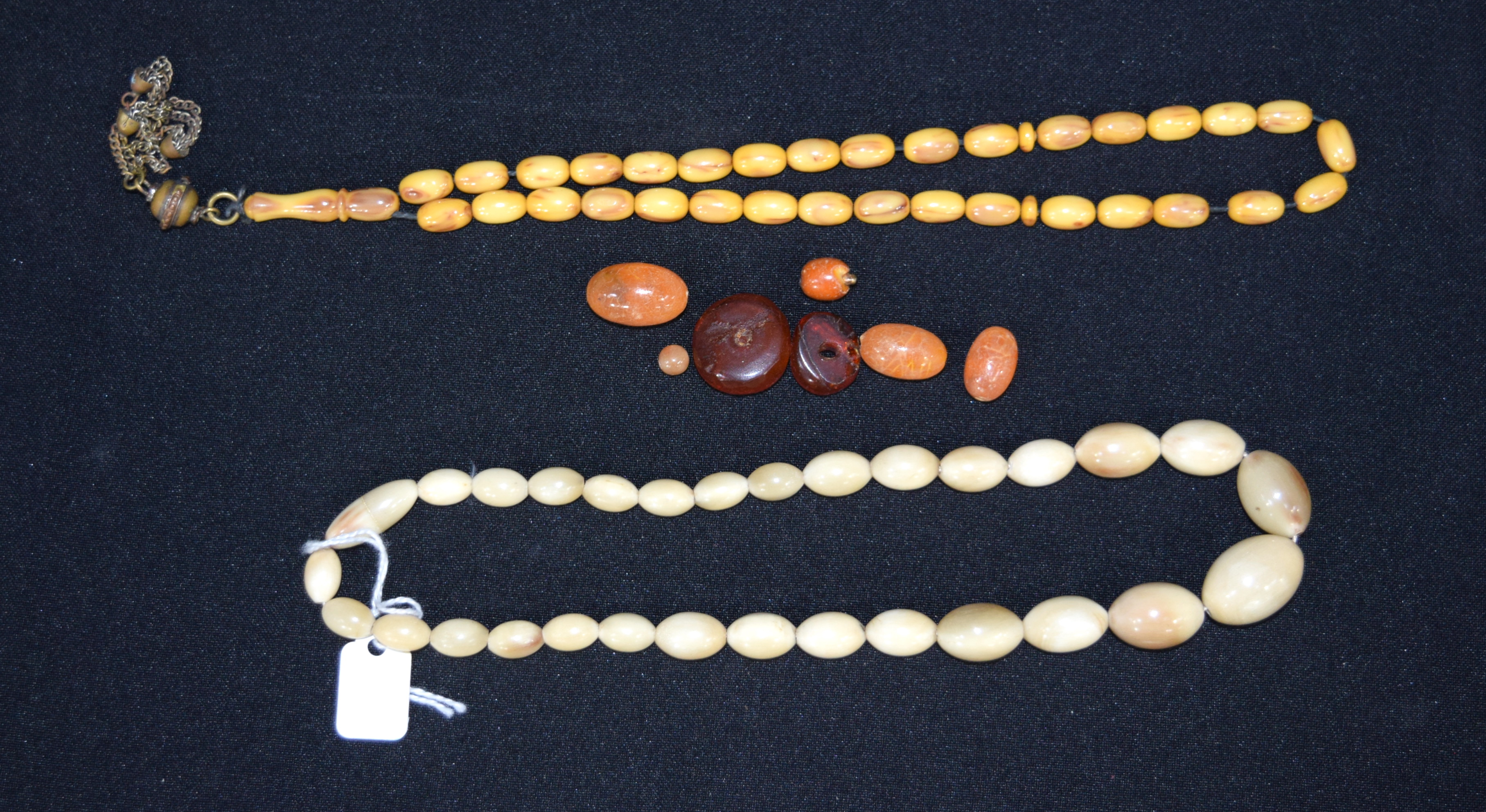 Two bone necklaces and amber beads largest 42cm