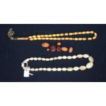 Two bone necklaces and amber beads largest 42cm