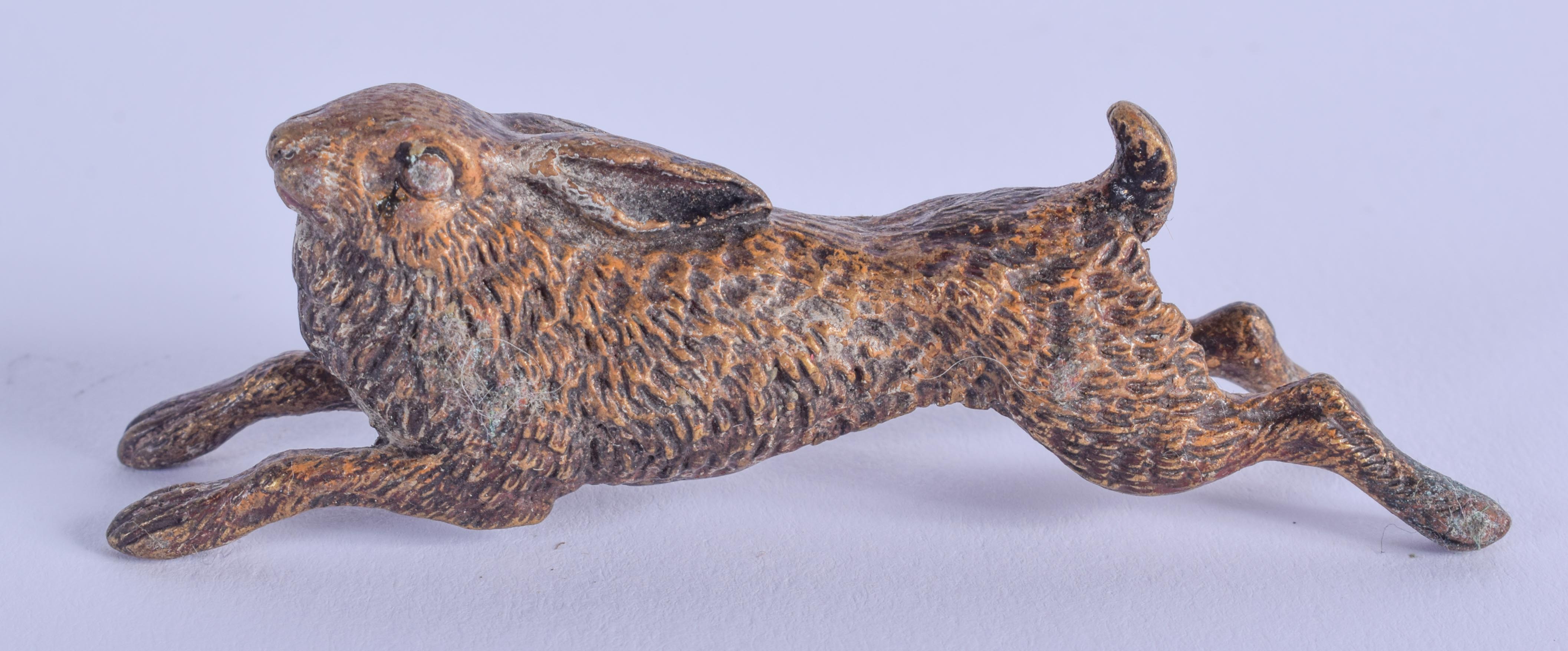 A COLD PAINTED BRONZE HARE. 7 cm wide.