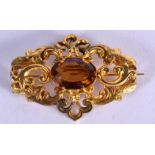 AN ANTIQUE YELLOW METAL AND TOPAZ BROOCH. 11.7 grams. 5.5 cm x 3.5 cm, topaz 2.5 cm x 1.5 cm.