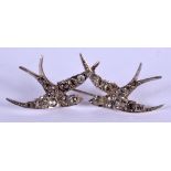 AN UNUSUAL ANTIQUE SILVER SWALLOW GEM SET BROOCH. 9 grams. 5.5 cm wide.