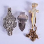 TWO ANTIQUE CONTINENTAL SILVER CLIPS and another. Silver 50 grams. (3)