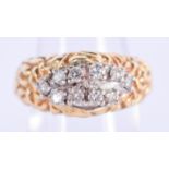 A STYLISH 1970S GOLD AND DIAMOND RING. 8.4 grams. M/N.