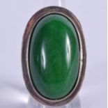 A SILVER AND JADE RING. N.