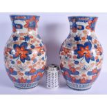 A LARGE PAIR OF 19TH CENTURY JAPANESE MEIJI PERIOD IMARI VASES painted with flowers. 37 cm x 15 cm.