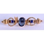 AN ANTIQUE 9CT GOLD AND SAPPHIRE BROOCH. 3.7 grams. Central stone 0.6 cm x 0.8 cm, 5 cm wide.