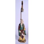 AN EARLY 20TH CENTURY SANCAI GLAZED POTTERY IMMORTAL converted to a lamp. Figure 28 cm high.