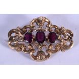 A LARGE EARLY VICTORIAN YELLOW METAL AND AMETHYST BROOCH. 9.7 grams. 6.5 cm x 4 cm.