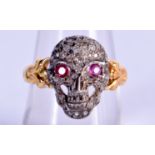 A VINTAGE 18CT GOLD DIAMOND AND RUBY SKULL RING. 4.2 grams. P.