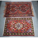 TWO VINTAGE SMALL RUGS. Largest 110 cm x 65 cm. (2)