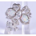 A SILVER OPAL AND CZ RING. P.