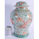 A 1930S CHINESE FAMILLE VERTE PORCELAIN JAR AND COVER decorated with phoenix birds and foliage. 42 c