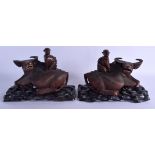 A PAIR OF 19TH CENTURY CHINESE CARVED HARDWOOD BUFFALOS upon fitted stands. 24 cm x 14 cm.