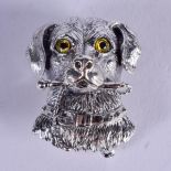 A SILVER DOG BROOCH. 2.5 cm x 1.5 cm.