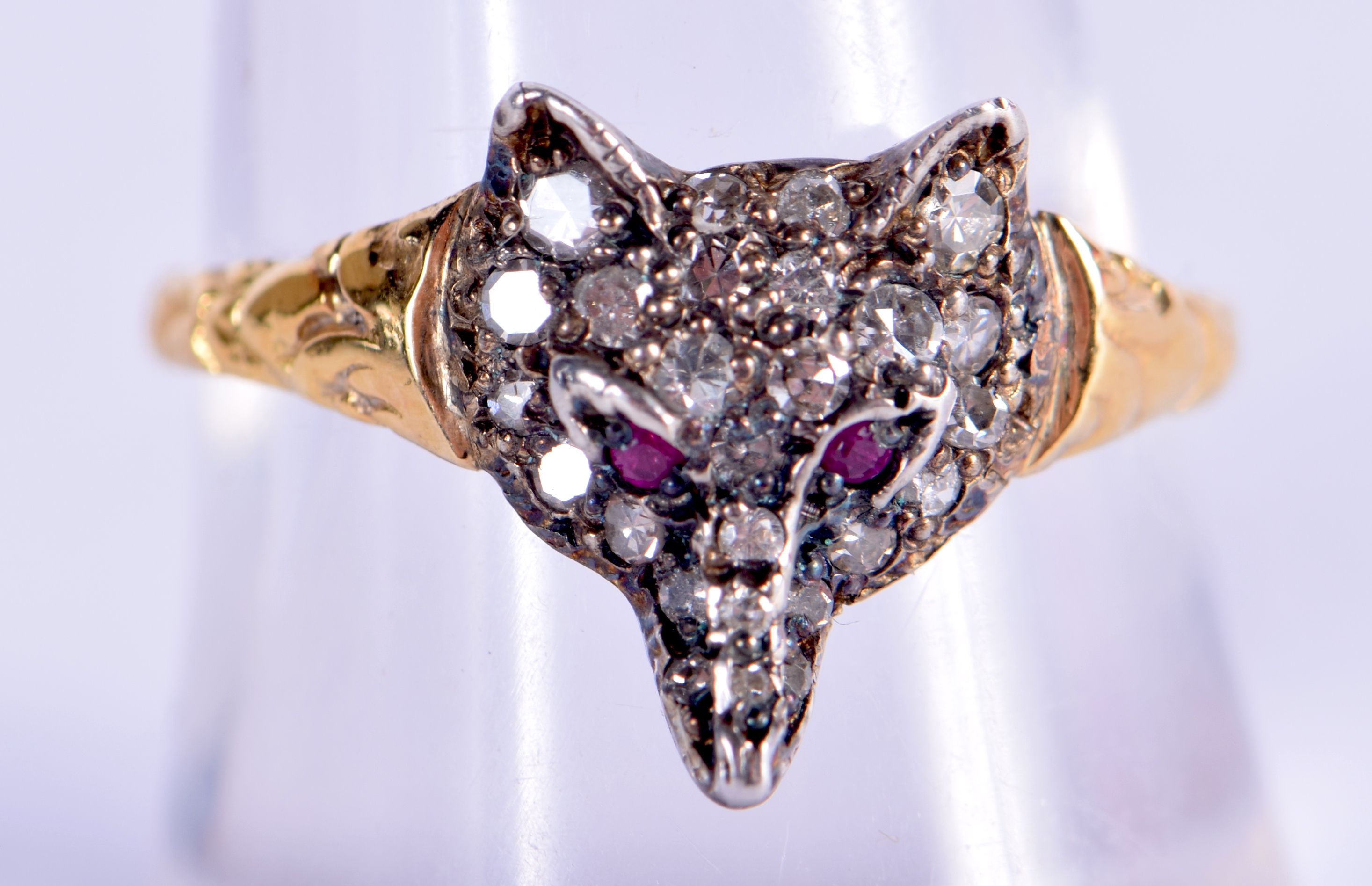 AN ANTIQUE GOLD AND SILVER RUBY FOX HEAD RING. 2 grams. Q.