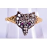AN ANTIQUE GOLD AND SILVER RUBY FOX HEAD RING. 2 grams. Q.