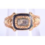 AN 18TH/19TH CENTURY YELLOW METAL ENAMEL MOURNING RING. 5.2 grams. O.