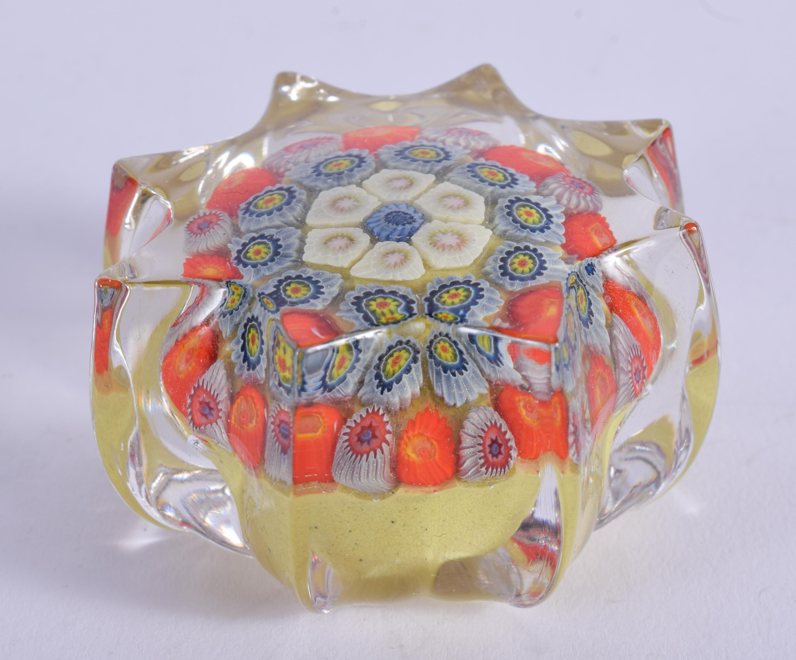 A VINTAGE GLASS PAPERWEIGHT. 4 cm wide.