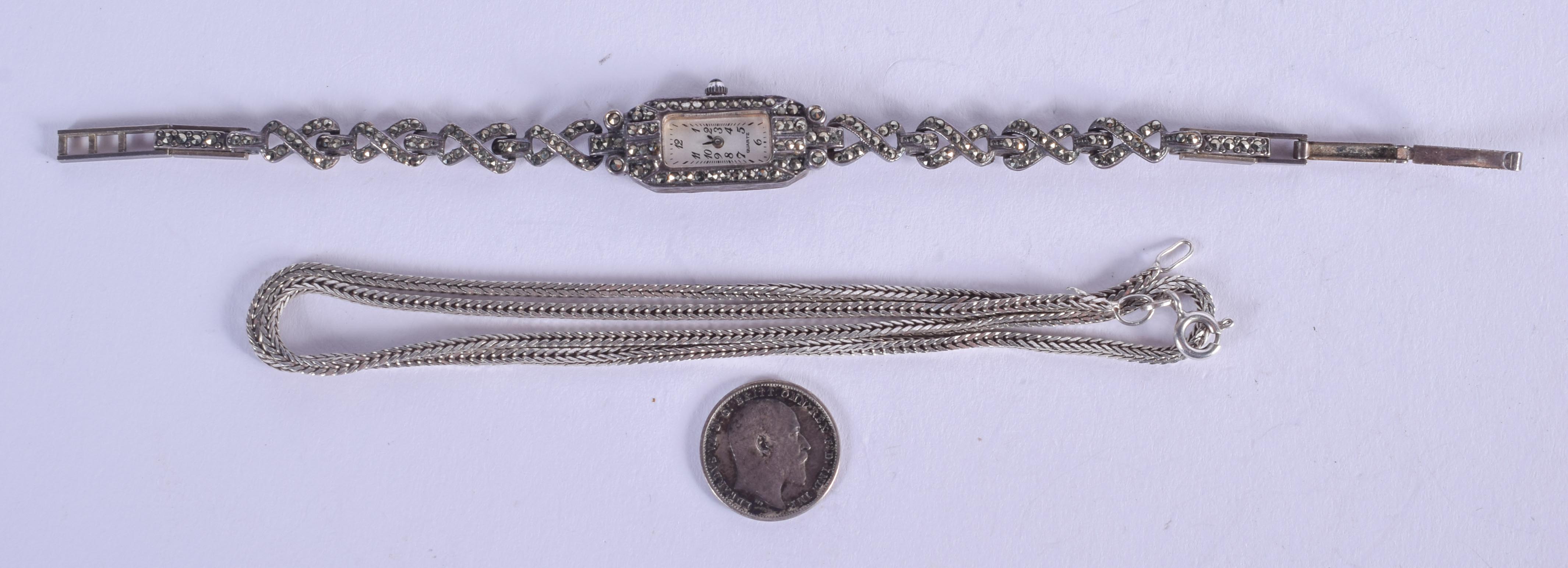 A SILVER NECKLACE and a dress watch. (2)