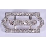 A FINE ART DECO PLATINUM AND DIAMOND BROOCH the three central stones of approx 1ct, encased within s
