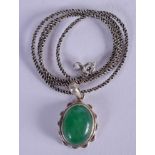 A SILVER AND JADE NECKLACE. Pendant 2.25 cm x 1.25 cm.