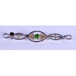 AN ANTIQUE WHITE METAL AND PERIDOT BROOCH. 3.4 grams. 5.5 cm long.