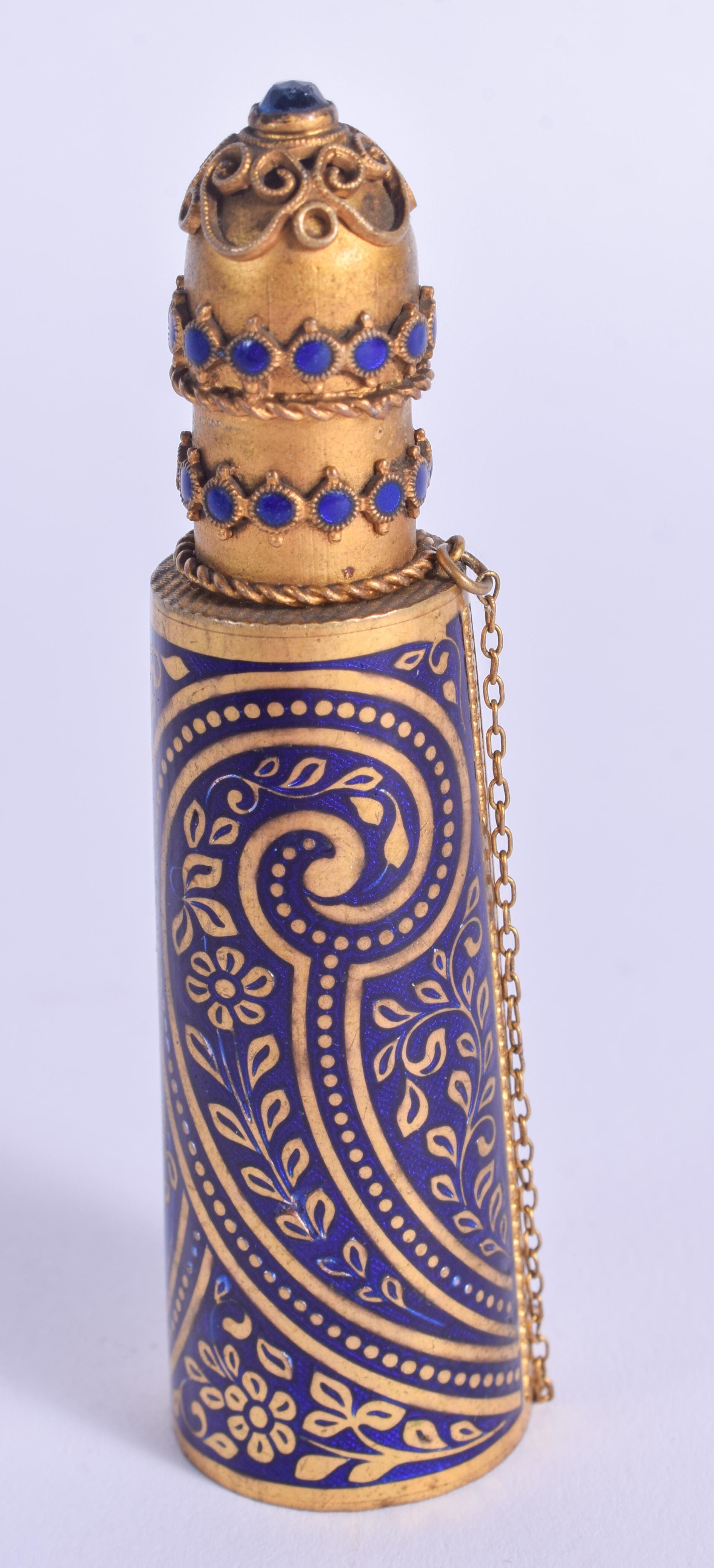 A VINTAGE MIDDLE EASTERN ENAMELLED SCENT BOTTLE. 7.25 cm high.