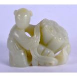 AN EARLY 20TH CENTURY CHINESE CARVED GREEN JADE FIGURE OF A BOY modelled holding a fruiting pod. 6.2