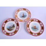 19th c. Minton set of three plates painted with scenes surrounded by a pink border in set with flora