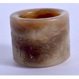 A 19TH CENTURY CHINESE CARVED MUTTON JADE ARCHERS RING. 2.75 cm wide.