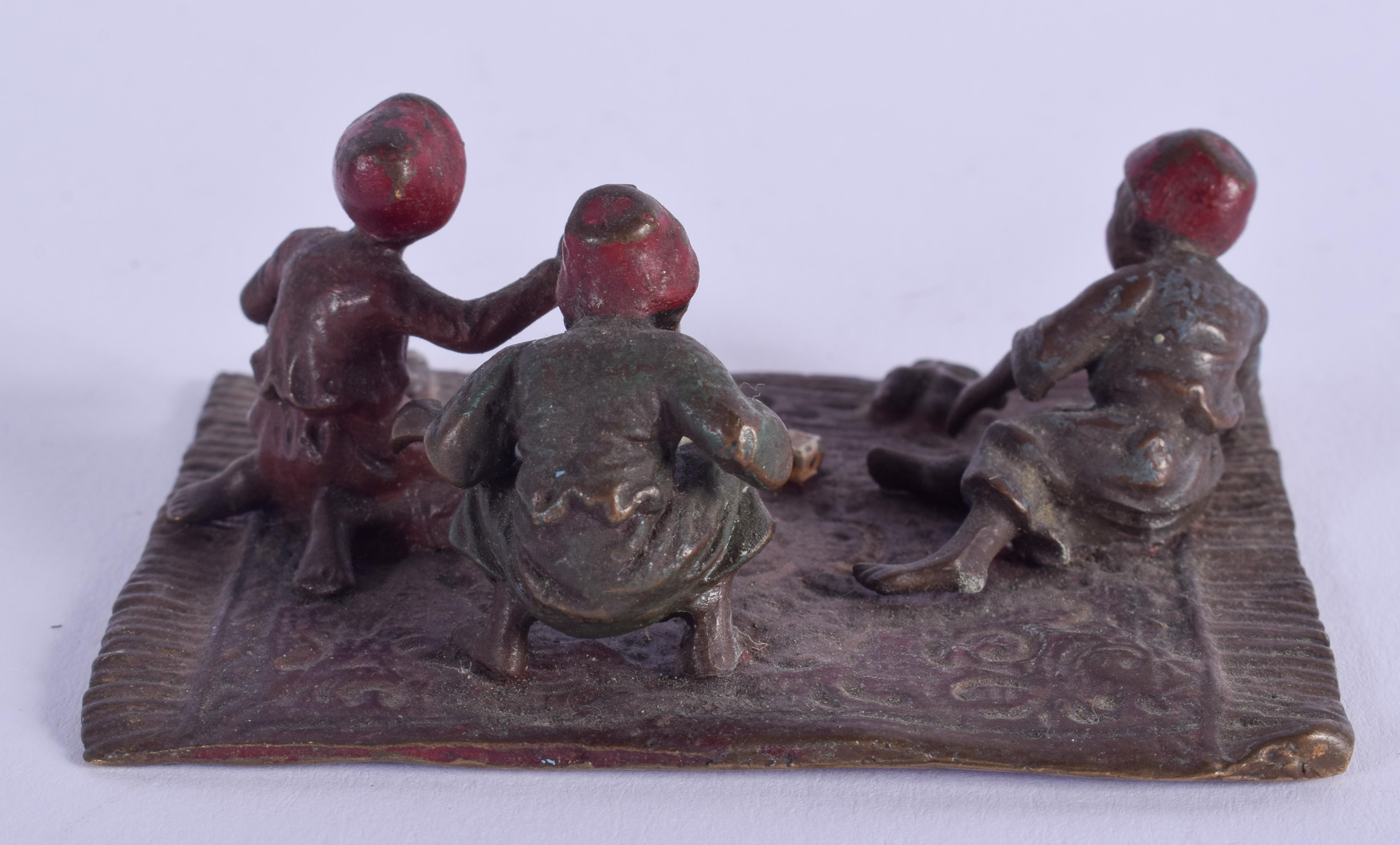 A COLD PAINTED BRONZE GROUP OF ARABIC CHILDREN. 8 cm x 5.5 cm. - Image 2 of 3