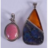 TWO SILVER PENDANTS. (2)