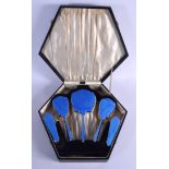 A CHARMING ART DECO SILVER PLATED AND ENAMEL DRESSING TABLE SET. Largest 24 cm x 10 cm. (5)