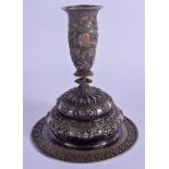 A 19TH CENTURY CHINESE TIBETAN SILVER BUDDHISTIC CANDLESTICK decorated with beasts. 134 grams. 15 cm